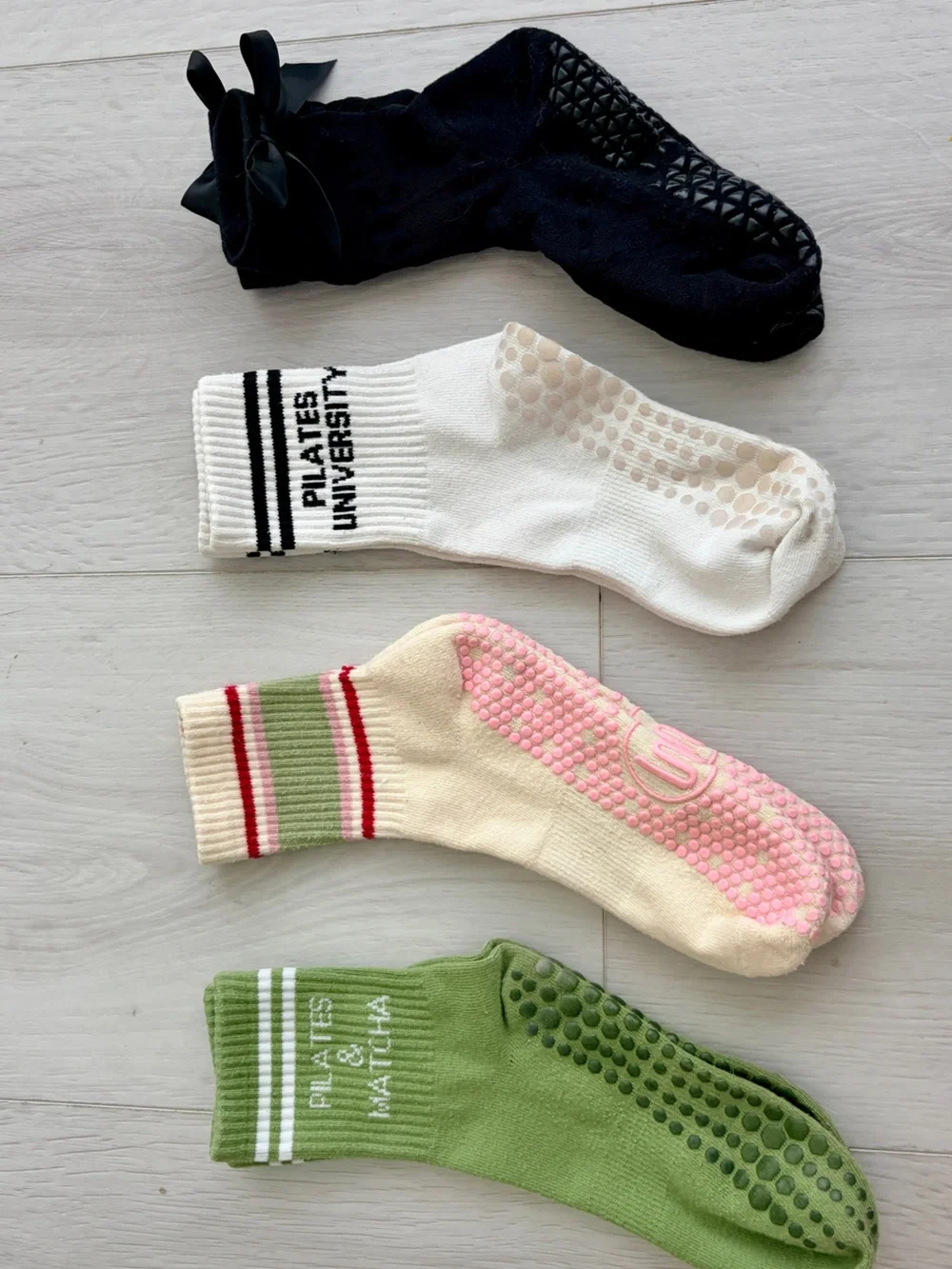 4 pairs of very gently used Pilates grip socks - crew length - women’s S/M.